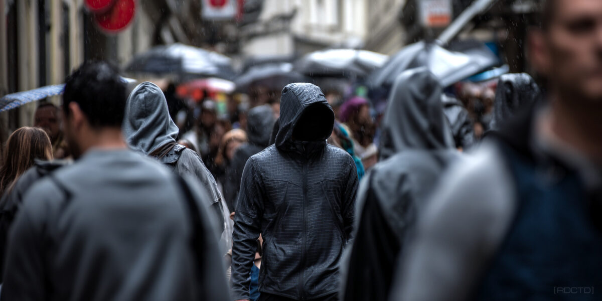 A Gray Man Walking in a Crowd of People in Prague, Czech Republic | RDCTD Tradecraft